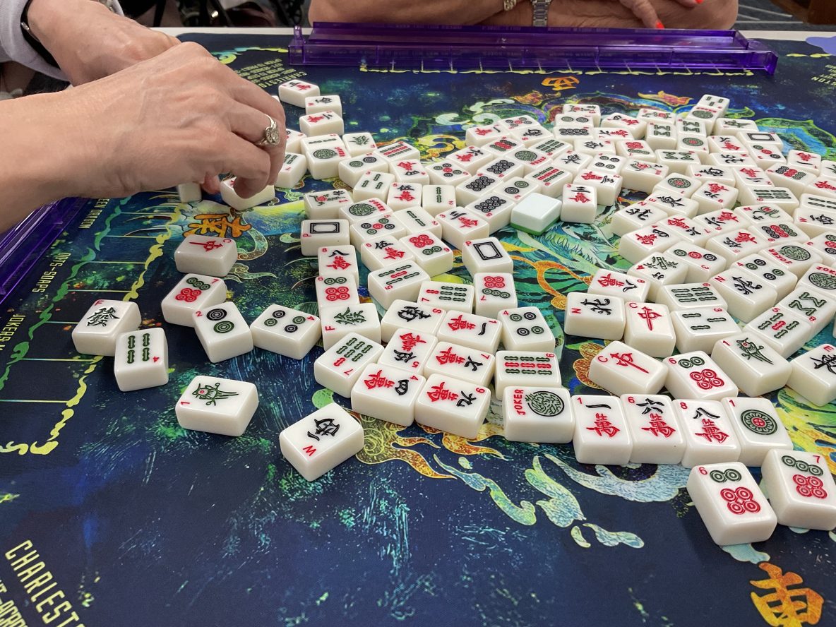 close up of mahjong table being shuffled