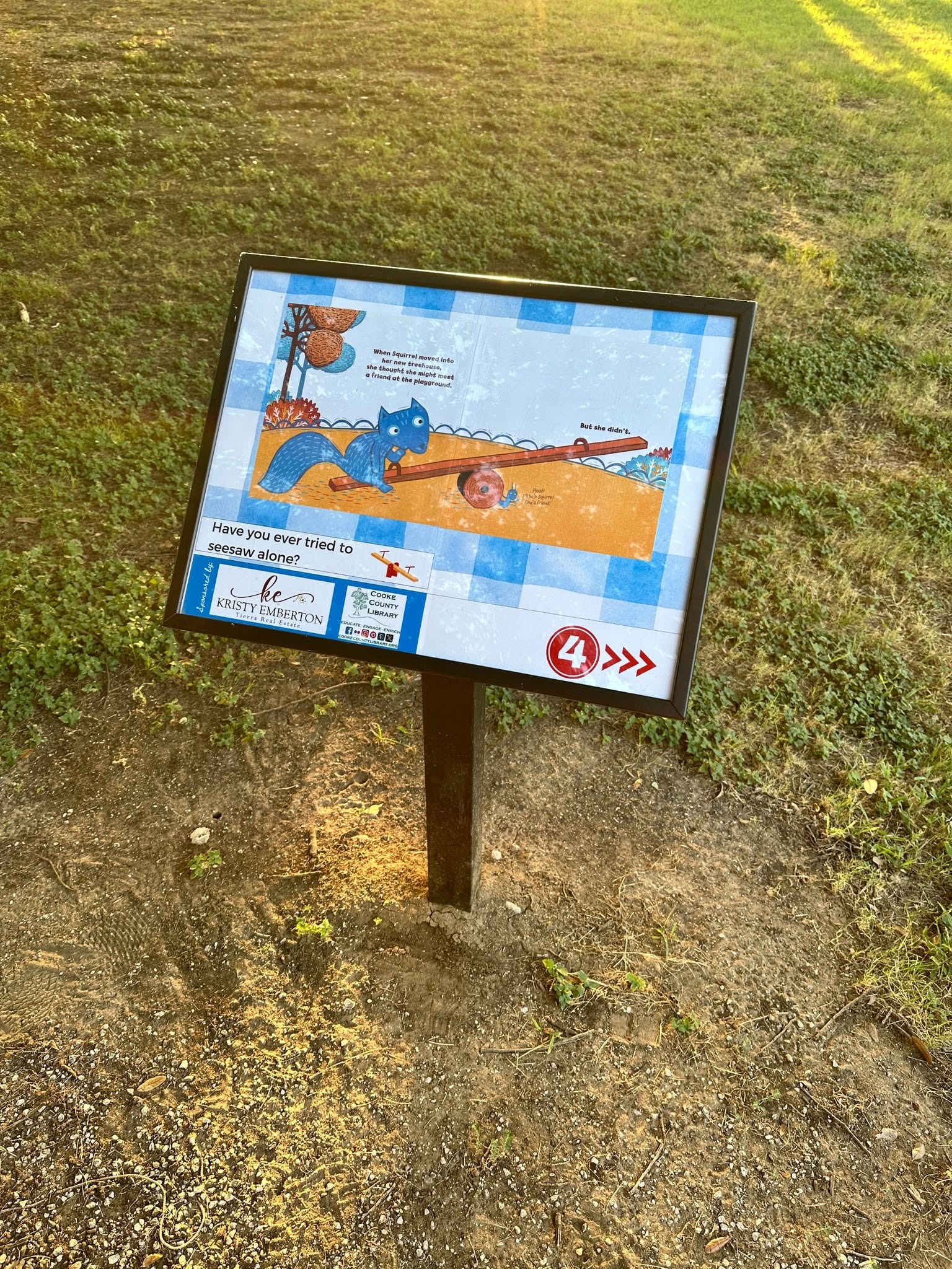 Picture of a book page in a display case at the park.